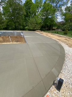 Freshly finished curved concrete pad