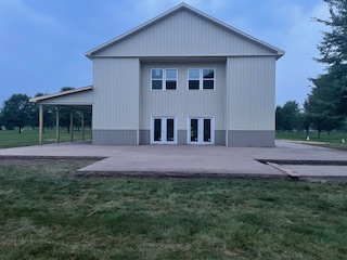 Finished barndominium with concrete walkways