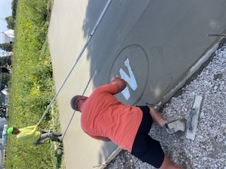Workers finishing a concrete slab